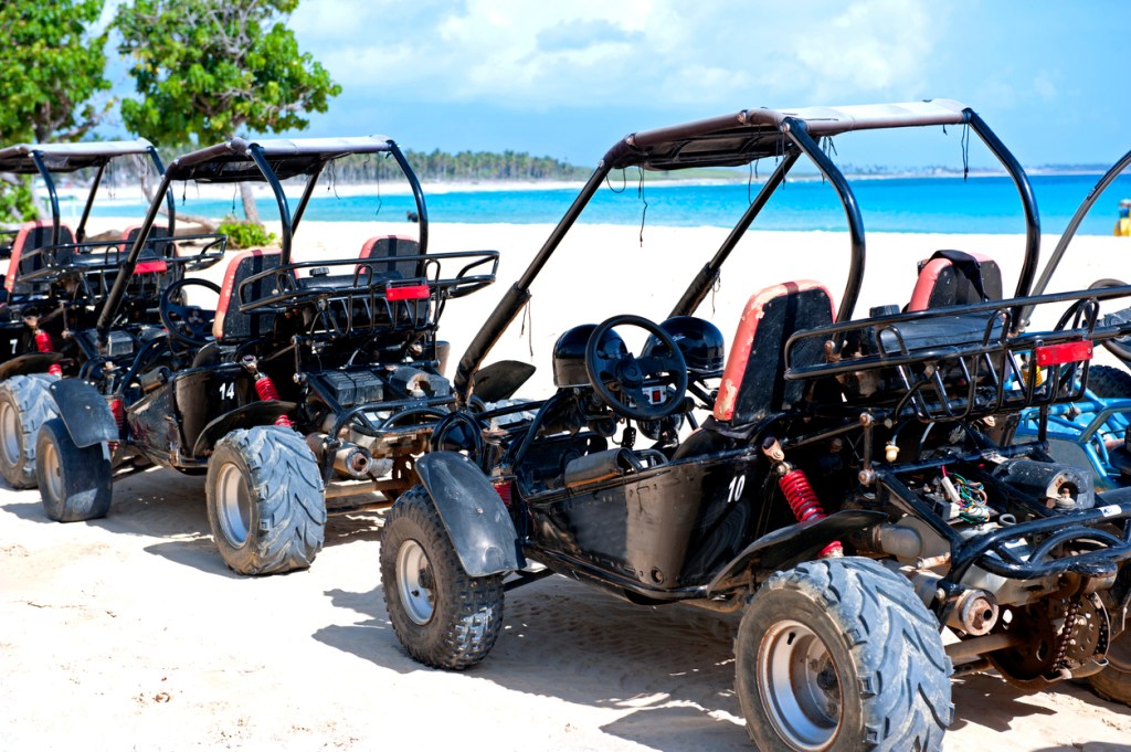 Dune buggies parked on the sandy beach